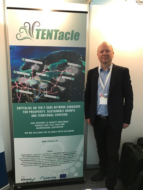 TENTacle project representative beside the project exhibition display